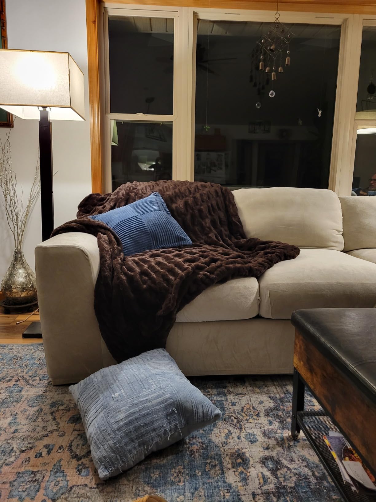 Customer photo showing Aruva SereneWeave throw decorating a Beige living room sofa with blue throw pillows.